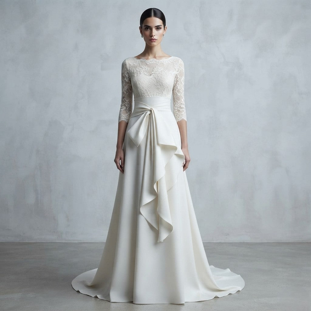 Vestido de novia de manga francesa con cuerpo de encaje transparente, cuello barco y un llamativo lazo drapeado en la cintura de la Colección Mara.